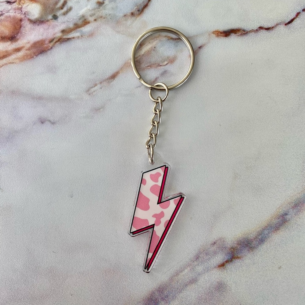 Brand new pink cow print lightning bolt keychain